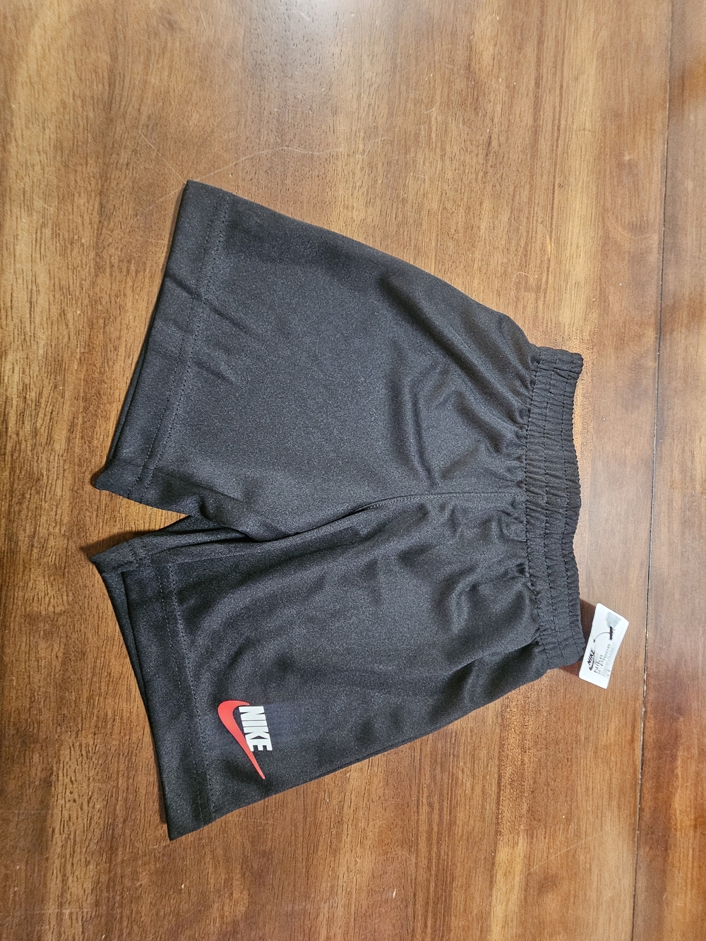 Nike Black Shorts with Red Swoosh and White Logo